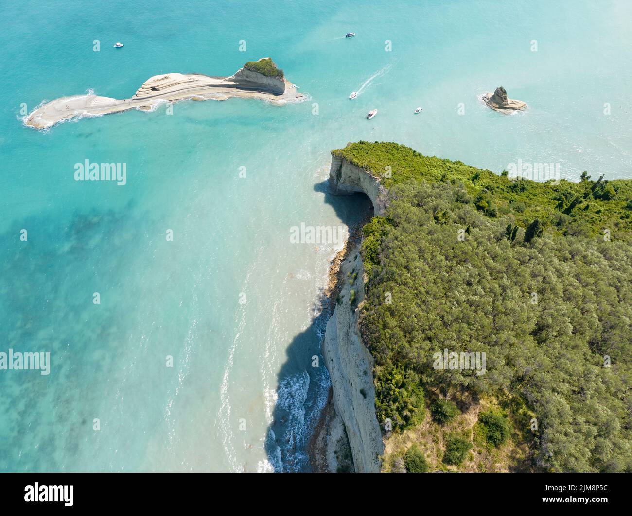 Aerial view of the cliff overlooking the sea near Apotripiti beach and of Mermaid`s rock, a promontory on the crystal clear sea. Corfu island, Greece Stock Photo